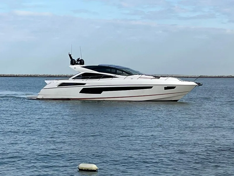 Slide: The Image of 2014 Sunseeker 68 Predator luxury yacht cruising on calm waters. - 32