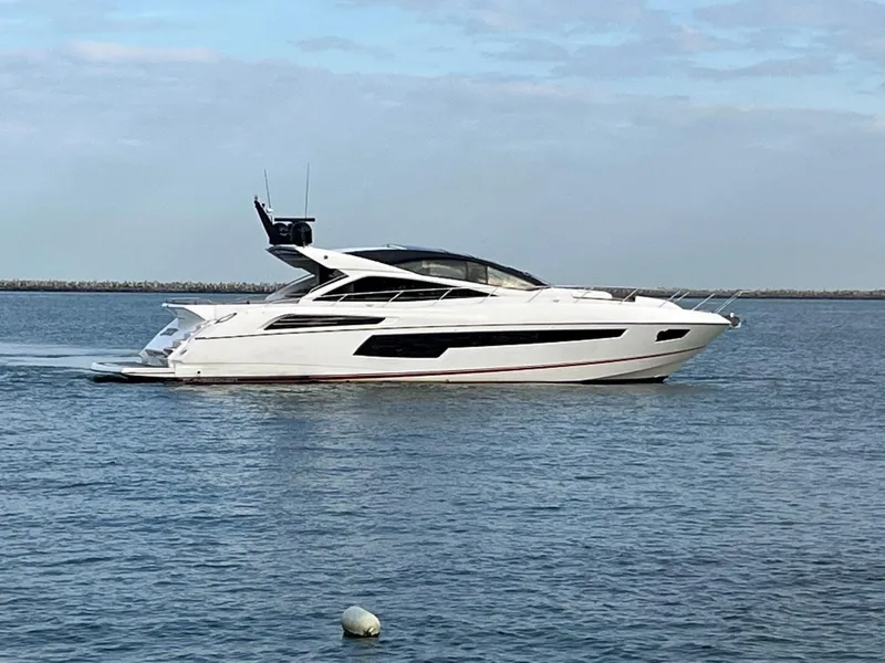 Slide: The Image of 2014 Sunseeker 68 Predator yacht cruising on calm waters. - 33