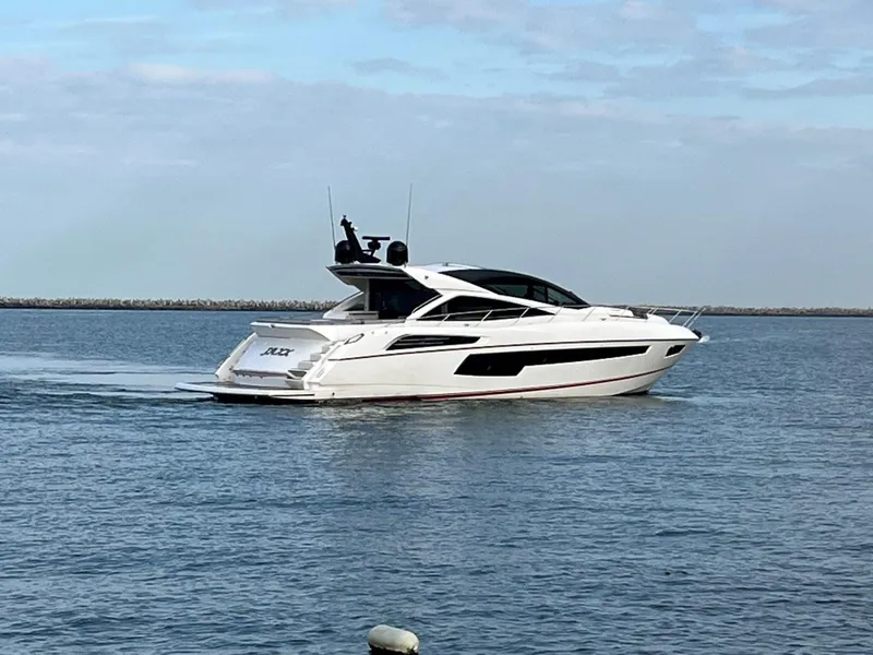 Slide: The Image of 2014 Sunseeker 68 Predator luxury yacht cruising on calm waters. - 34
