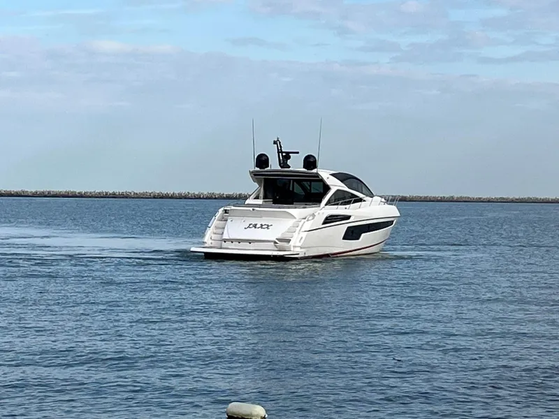 Slide: The Image of 2014 Sunseeker 68 Predator yacht cruising on calm waters. - 35