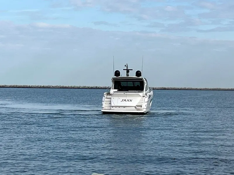 Slide: The Image of 2014 Sunseeker 68 Predator yacht cruising on calm waters. - 36