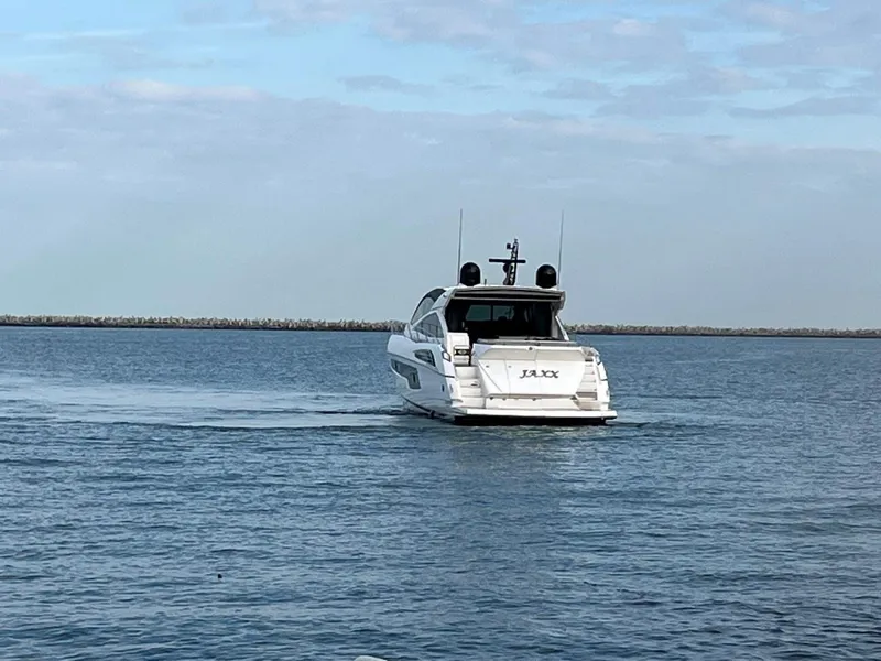 Slide: The Image of 2014 Sunseeker 68 Predator yacht cruising on open water. - 37