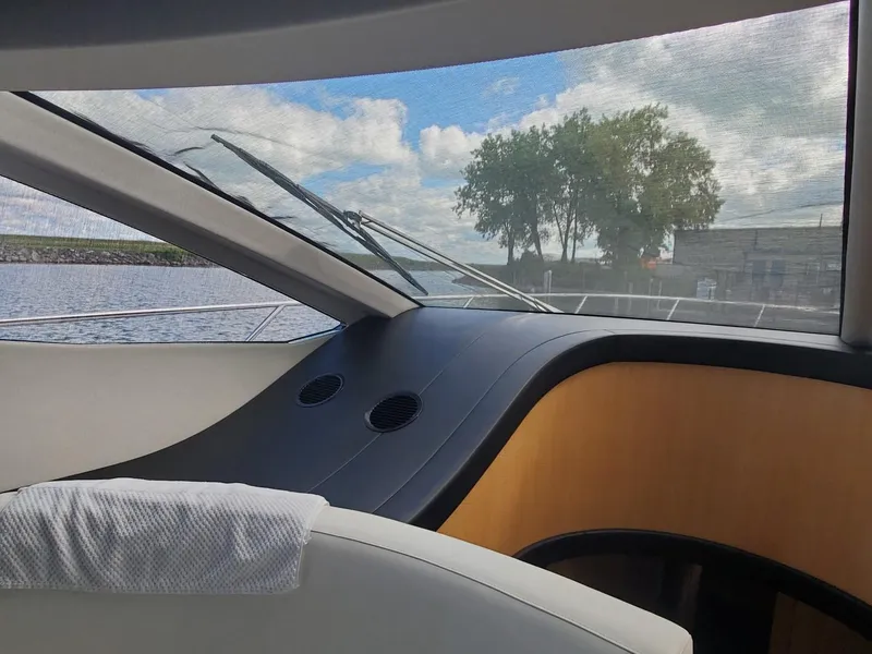 Slide: The Image of Interior view of 2014 Sunseeker 68 Predator yacht with scenic water and trees. - 7