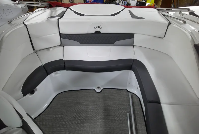 Slide: The Image of 2023 Monterey 224FS boat interior with white and gray seating. - 11
