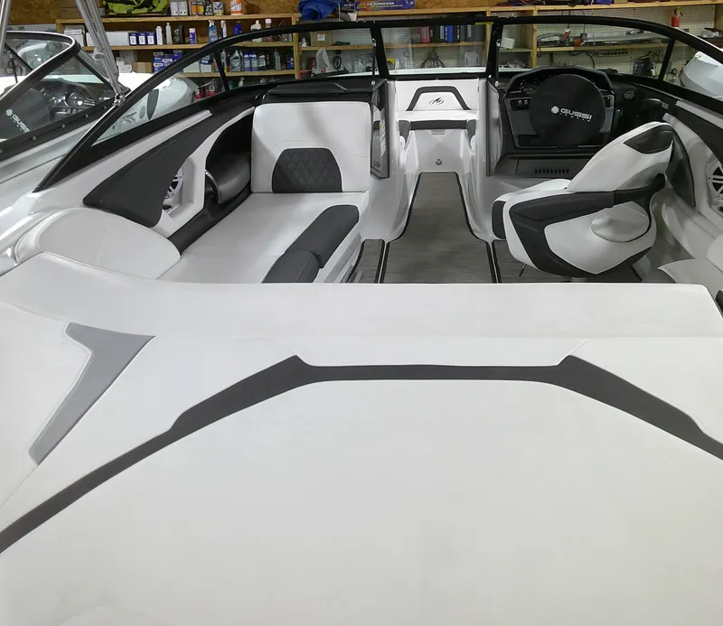 Slide: The Image of Interior of a 2023 Monterey 224FS boat with white and gray seating. - 12