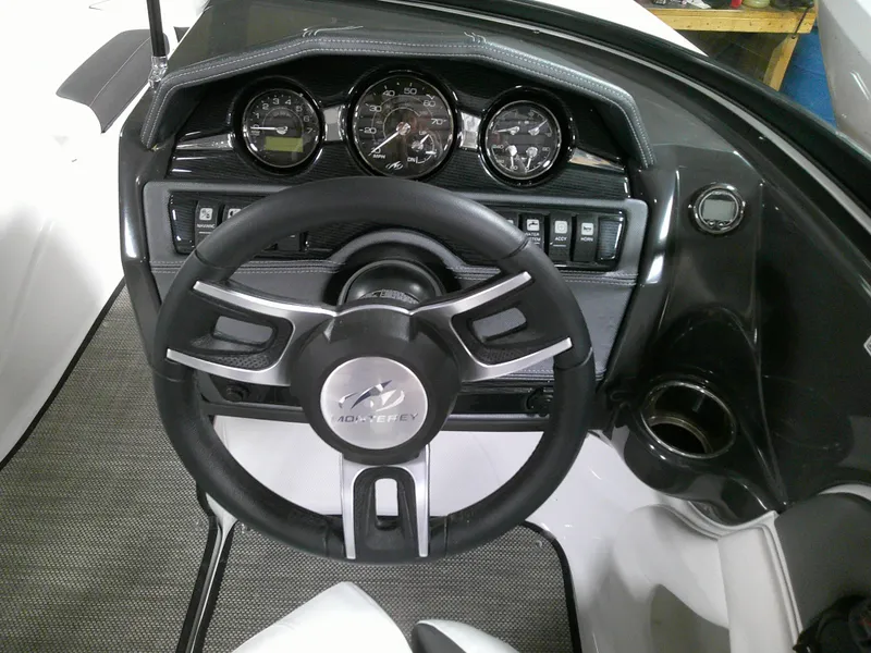 Slide: The Image of 2023 Monterey 224FS boat dashboard with steering wheel and instrument panel. - 5