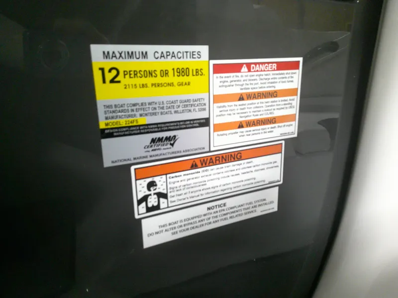 Slide: The Image of 2023 Monterey 224FS boat capacity and safety warning labels. - 7