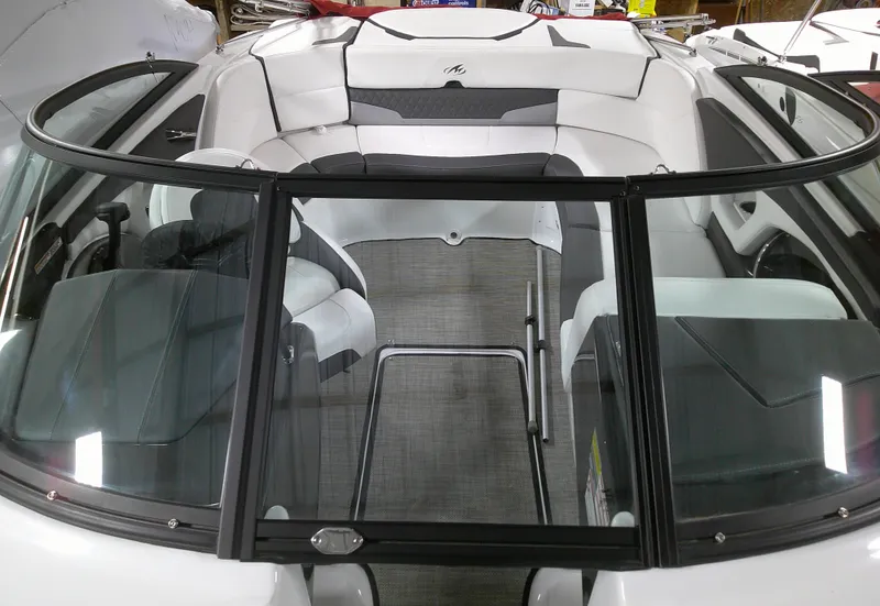 Slide: The Image of 2023 Monterey 224FS boat interior with white and gray seating. - 8