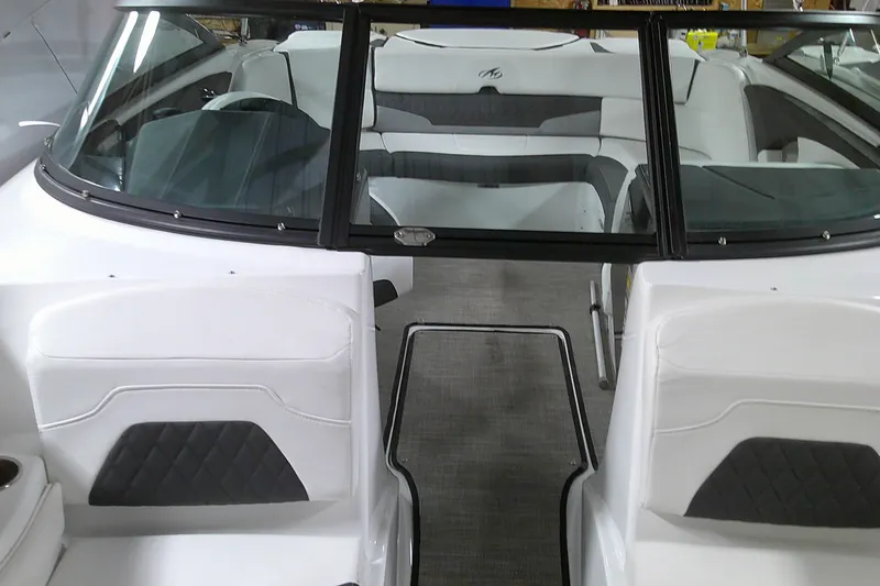 Slide: The Image of 2023 Monterey 224FS boat interior with white and black seating. - 9