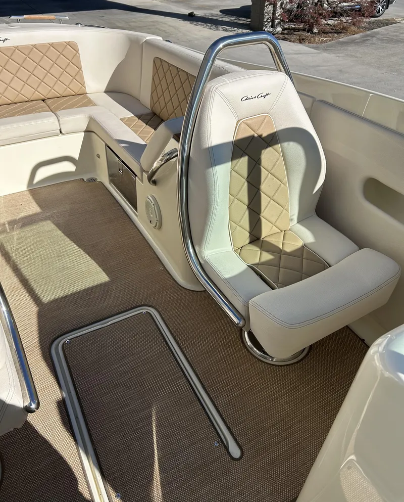Slide: The Image of 2020 Chris-Craft Launch 27 interior with beige diamond-stitched upholstery and stainless steel accents. - 8