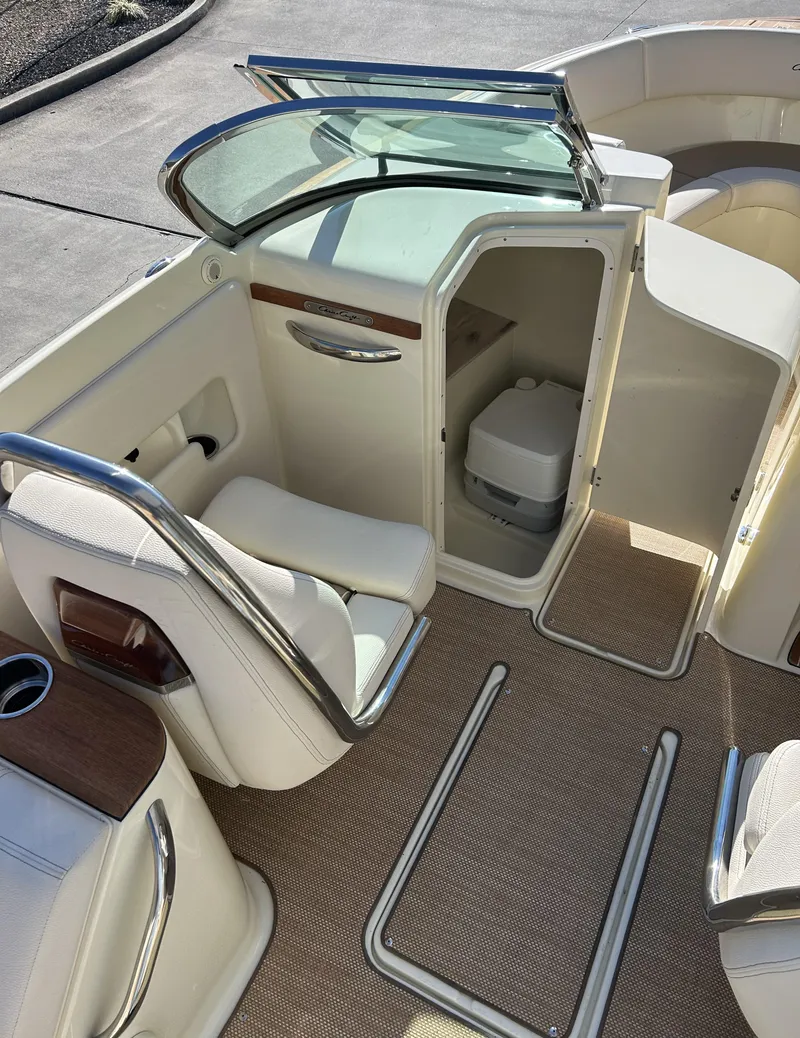 Slide: The Image of 2020 Chris-Craft Launch 27 interior with seating and toilet compartment. - 9