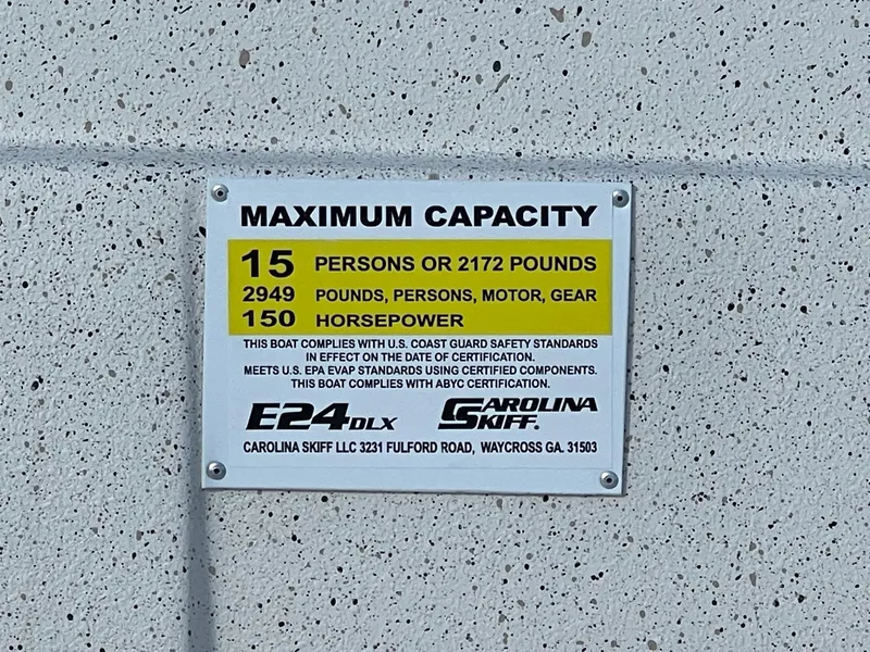 Slide: The Image of 2024 Carolina Skiff e24 dlx maximum capacity plate: 15 persons, 2172 lbs, 150 horsepower. - 6