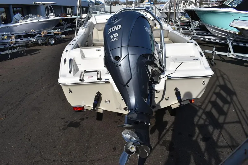 Slide: The Image of 2024 Key West 239 DFS boat with Yamaha 300 V6 engine, parked on a trailer. - 12