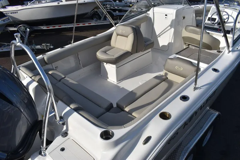Slide: The Image of 2024 Key West 239 DFS boat interior with seating and console. - 14
