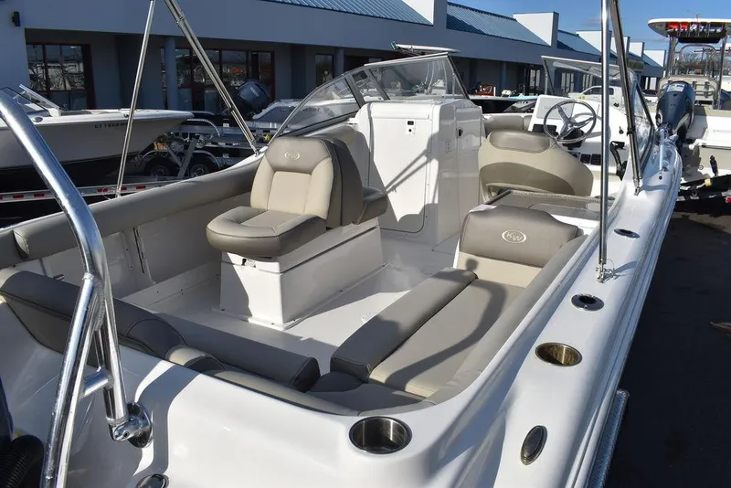 Slide: The Image of 2024 Key West 239 DFS boat interior with seating and console, displayed outdoors. - 17