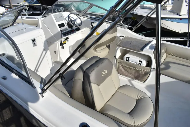 Slide: The Image of 2024 Key West 239 DFS boat interior with seating and console. - 19
