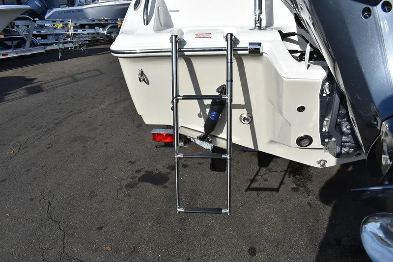 Slide: The Image of 2024 Key West 239 DFS boat with rear ladder and motor mount. - 26