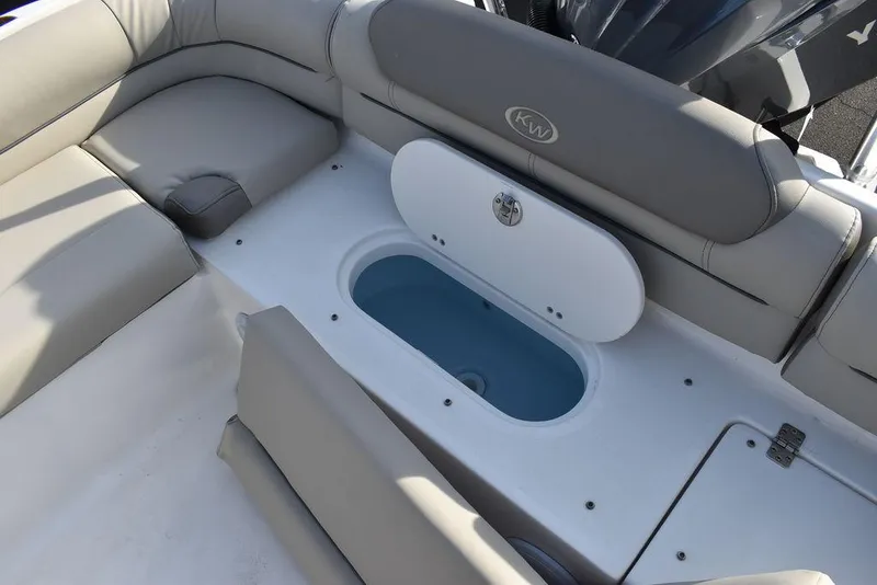 Slide: The Image of 2024 Key West 239 DFS boat interior with seating and storage compartment. - 30