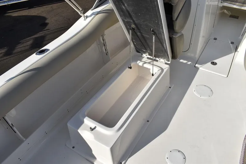 Slide: The Image of 2024 Key West 239 DFS boat with open storage compartment on deck. - 36