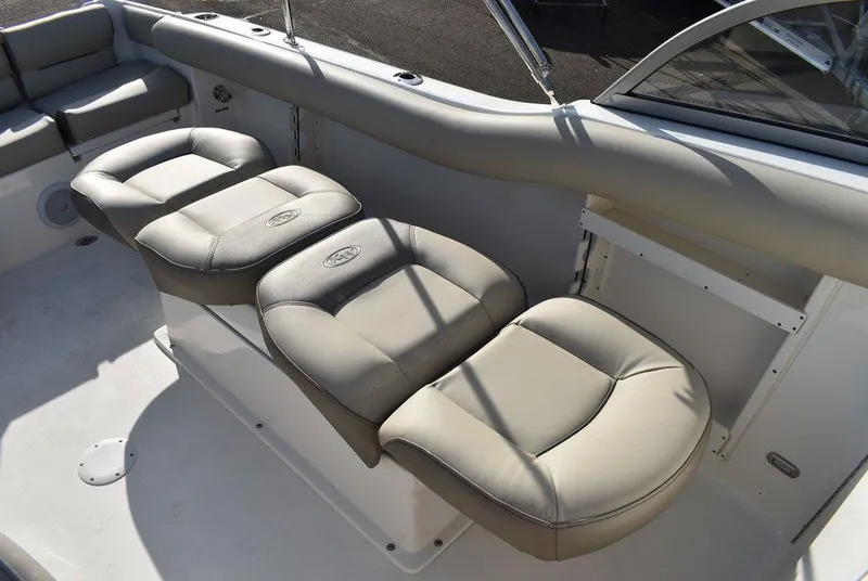Slide: The Image of 2024 Key West 239 DFS boat with comfortable beige seating arrangement. - 37