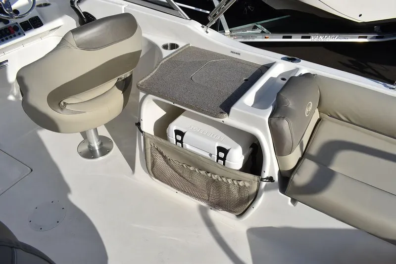 Slide: The Image of 2024 Key West 239 DFS boat interior with seating and storage area. - 38