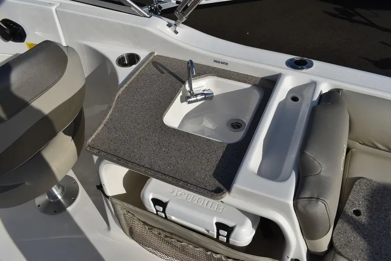 Slide: The Image of 2024 Key West 239 DFS boat interior with sink and seating area. - 39