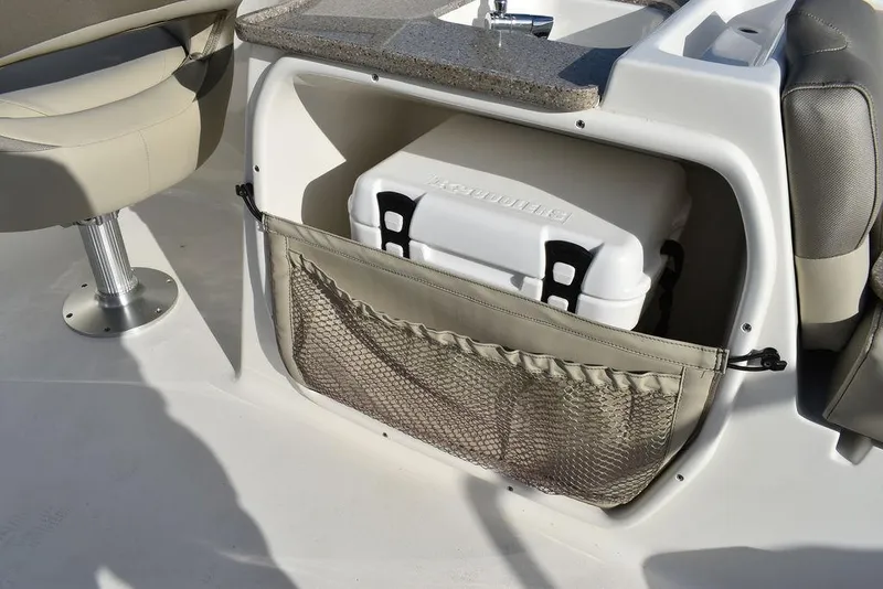 Slide: The Image of 2024 Key West 239 DFS boat interior with storage compartment and cooler. - 40
