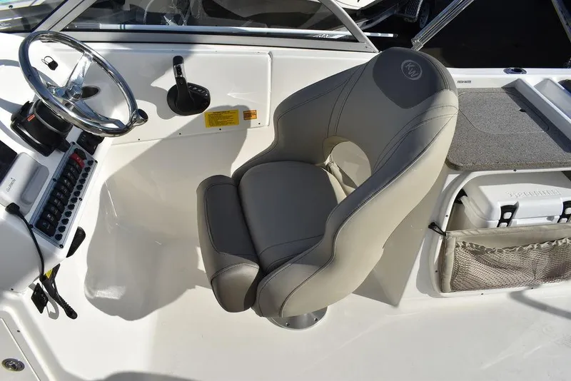 Slide: The Image of 2024 Key West 239 DFS boat cockpit with steering wheel and comfortable seating. - 41