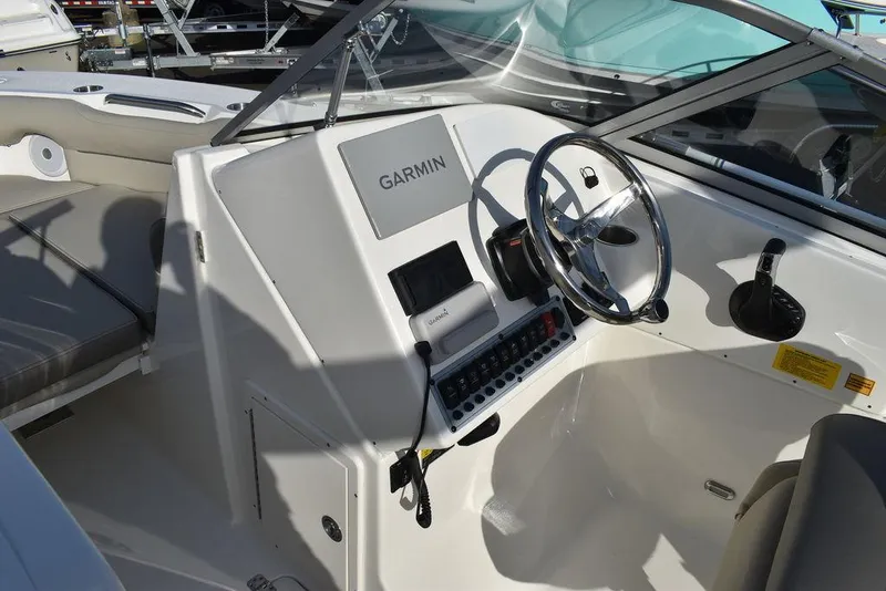 Slide: The Image of 2024 Key West 239 DFS boat dashboard with Garmin navigation system. - 43