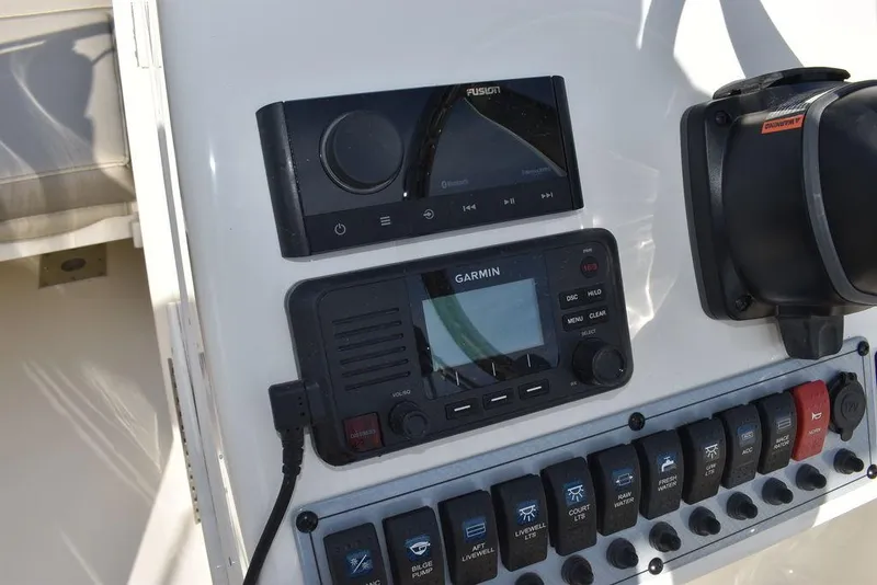 Slide: The Image of 2024 Key West 239 DFS dashboard with Garmin and Fusion controls. - 47