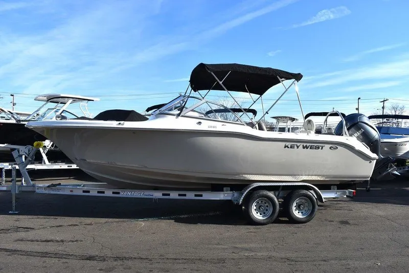 Slide: The Image of 2024 Key West 239 DFS boat on trailer, side view, sunny day. - 6