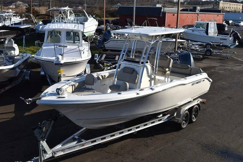 The Image of 2024 Key West 239 FS boat on trailer in marina setting. - 0