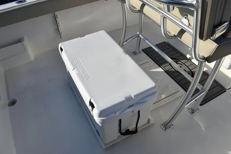 Slide: The Image of 2024 Key West 239 FS boat interior with cooler and seating area. - 12