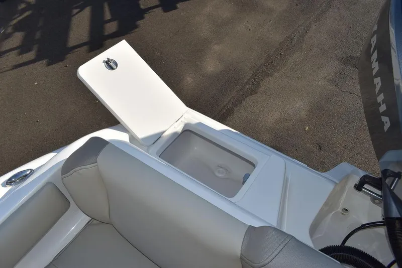 Slide: The Image of 2024 Key West 239 FS boat interior with open storage compartment. - 17