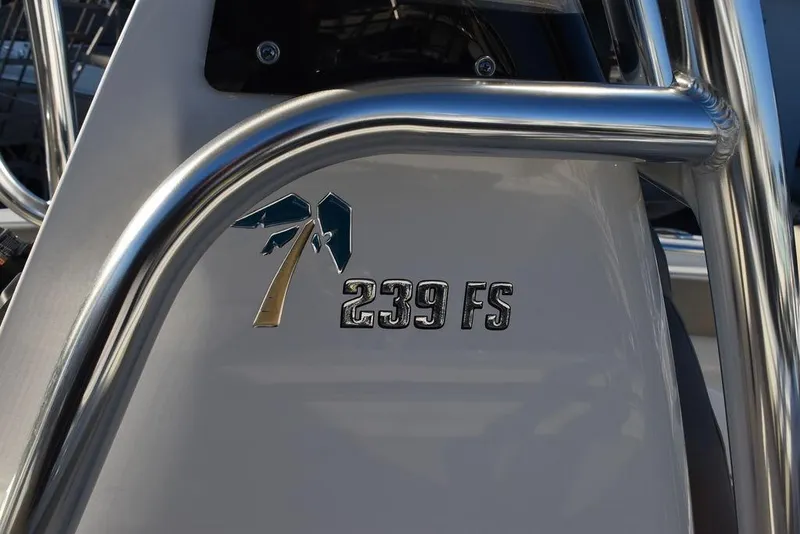 Slide: The Image of 2024 Key West 239 FS boat logo with palm tree design. - 27