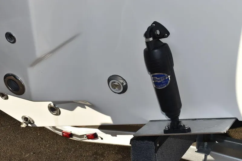 Slide: The Image of 2024 Key West 239 FS boat detail with trim tab and hydraulic actuator. - 31