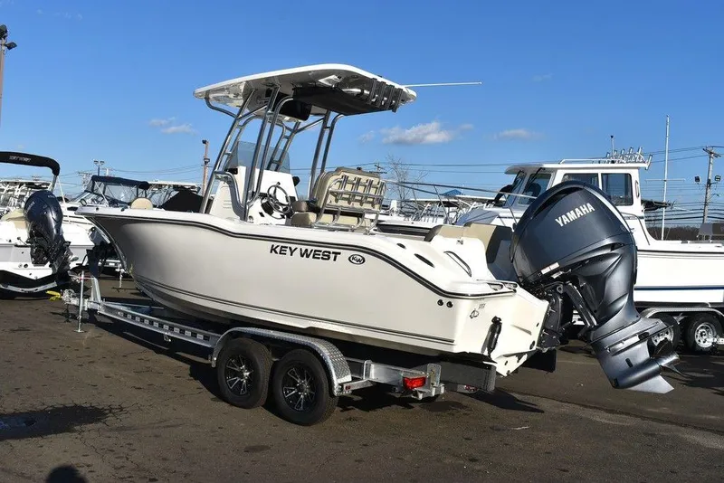 Slide: The Image of 2024 Key West 239 FS boat with Yamaha outboard motor on trailer. - 4
