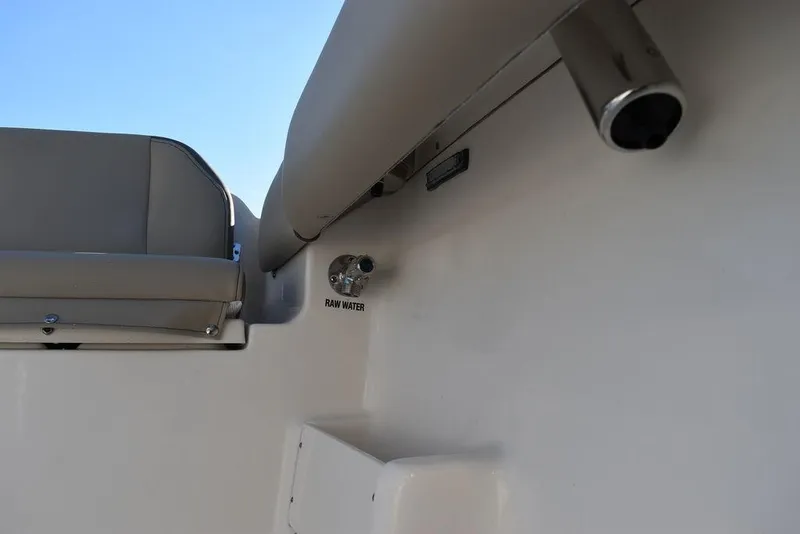 Slide: The Image of 2024 Key West 239 FS boat interior with raw water outlet and seating. - 41