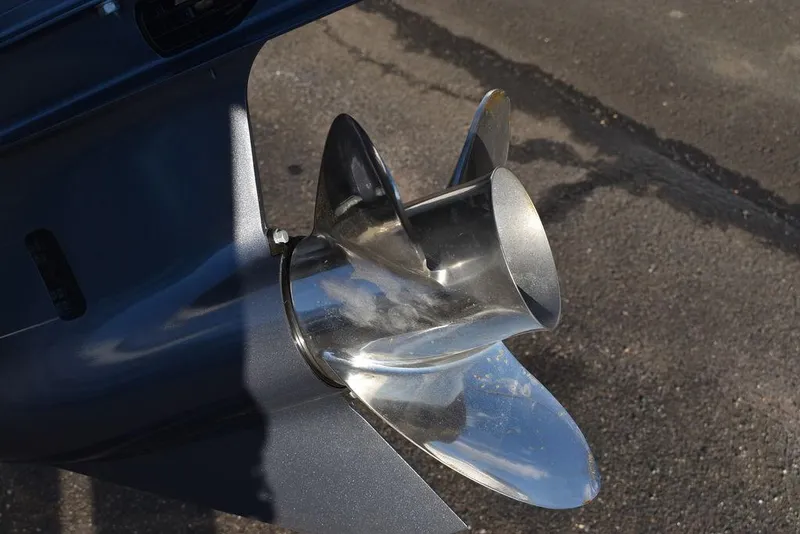 Slide: The Image of 2024 Key West 239 FS boat propeller, shiny metal finish, close-up view. - 48