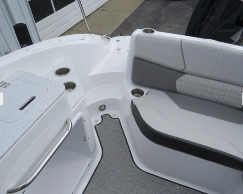 Slide: The Image of Interior seating of 2023 Hurricane SunDeck 2400 OB boat with cup holders. - 13