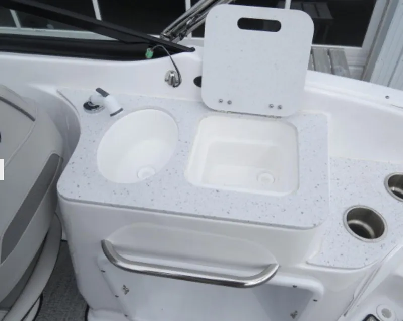 Slide: The Image of 2023 Hurricane SunDeck 2400 OB boat sink and countertop with cup holders. - 14