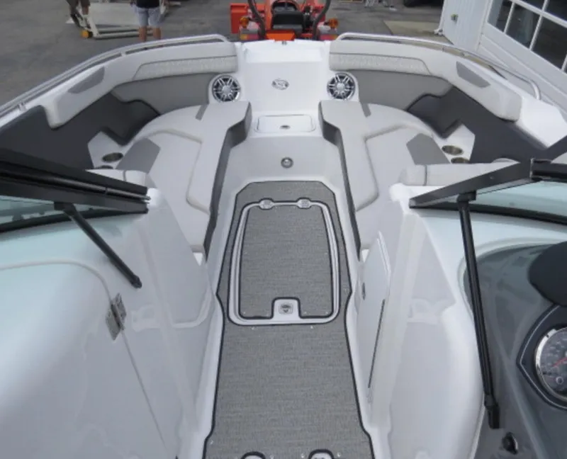 Slide: The Image of 2023 Hurricane SunDeck 2400 OB boat interior with seating and speakers. - 15