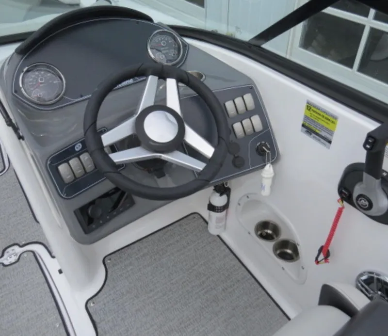 Slide: The Image of 2023 Hurricane SunDeck 2400 OB boat cockpit with steering wheel and control panel. - 20