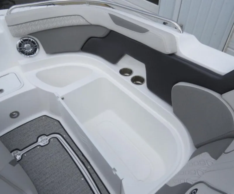 Slide: The Image of 2023 Hurricane SunDeck 2400 OB boat interior with seating and storage compartments. - 23