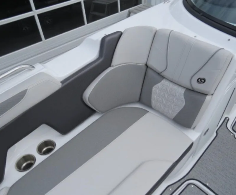 Slide: The Image of 2023 Hurricane SunDeck 2400 OB boat seating area with cup holders and stylish upholstery. - 24