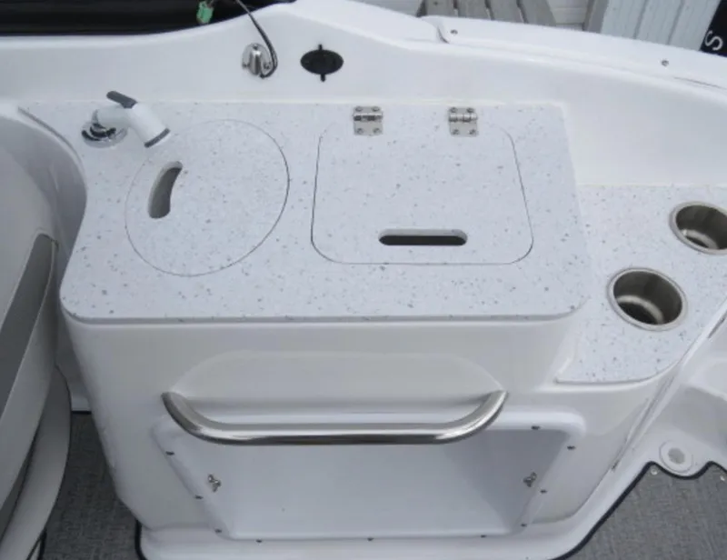Slide: The Image of 2023 Hurricane SunDeck 2400 OB boat interior with sink and storage. - 26