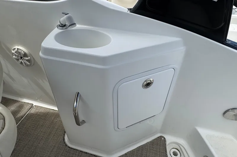 Slide: The Image of 2018 Hurricane SD 2400 I/O boat interior with sink and storage compartment. - 12