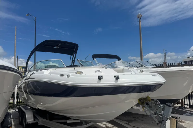 Slide: The Image of 2018 Hurricane SD 2400 I/O boat on trailer under clear blue sky. - 2