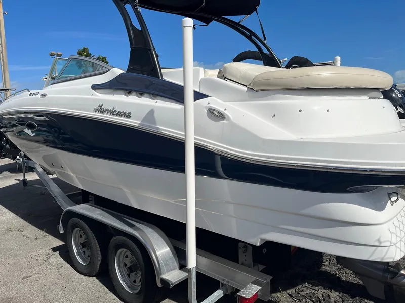 Slide: The Image of 2018 Hurricane SD 2400 I/O boat on a trailer under a clear blue sky. - 4
