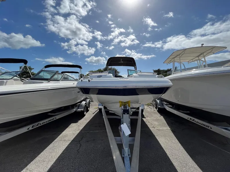Slide: The Image of 2018 Hurricane SD 2400 I/O boat on trailer under sunny sky. - 7